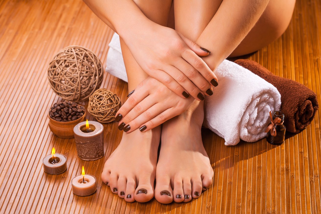 brown manicure and pedicure on the bamboo