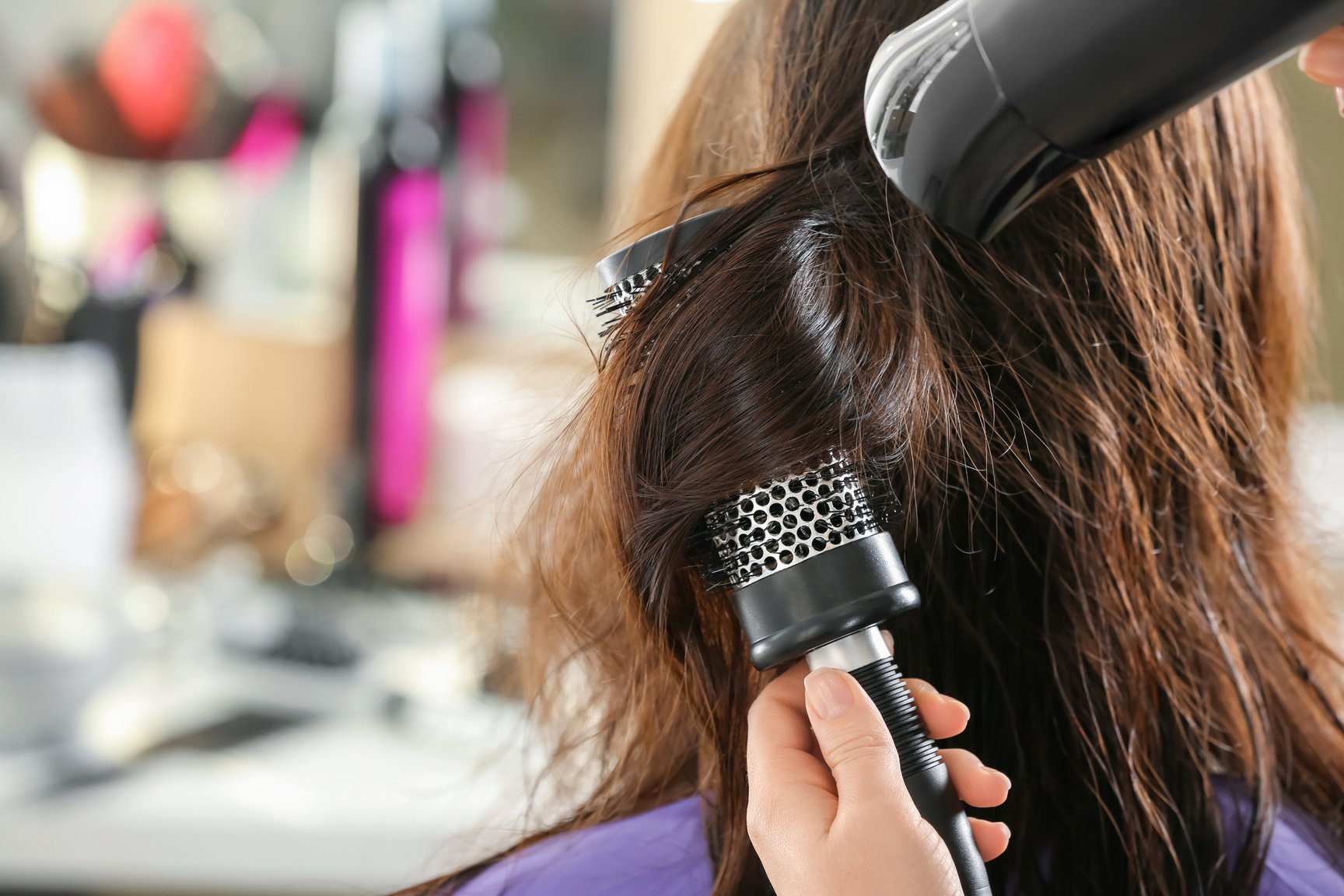 Hairdresser Blowdrying Hair